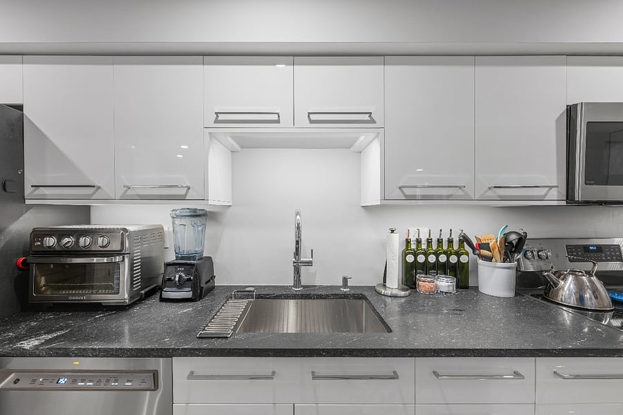 Deep kitchen sink with disposal and dishwasher.