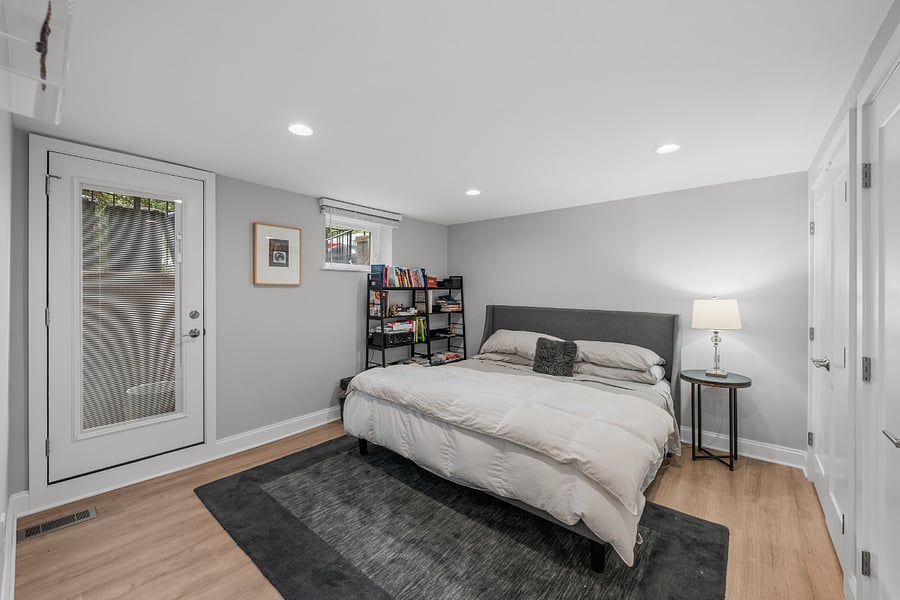 Large primary bedroom with Saatva king-sized bed and two double closets and private entrance.