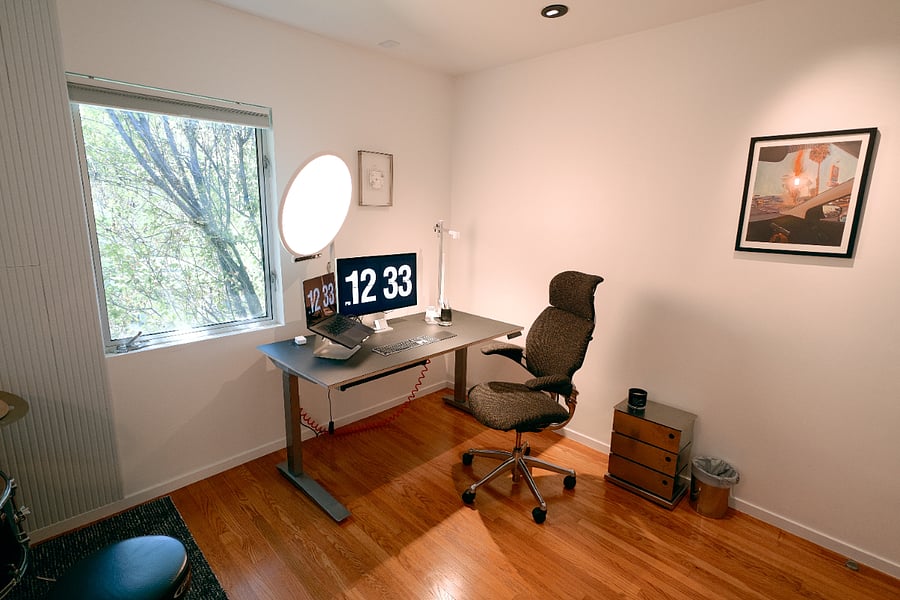 Standing desk, Apple Studio Display, studio lighting and microphone