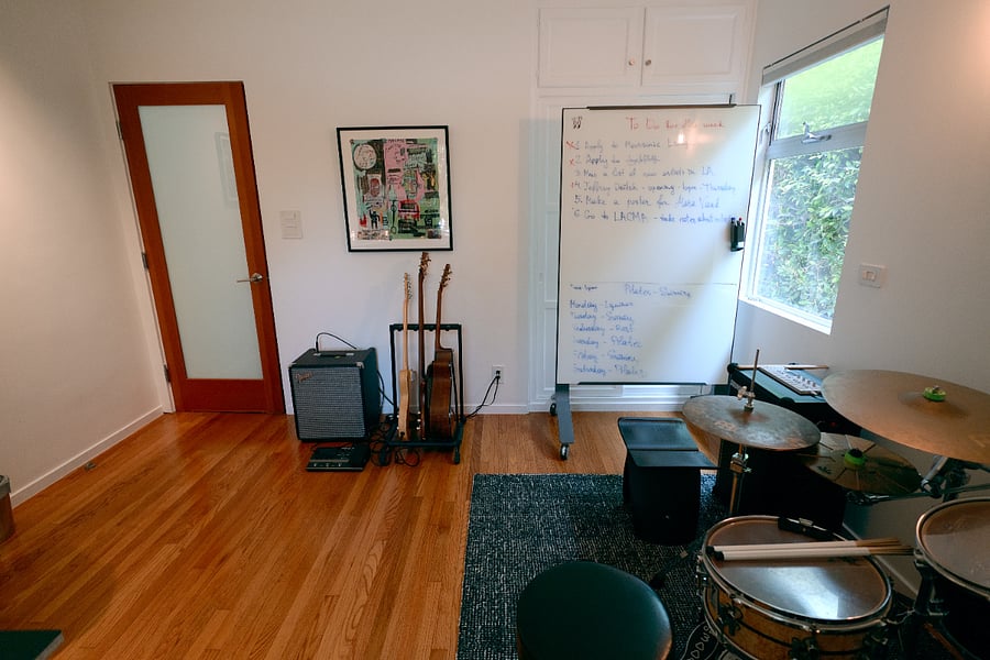 Drums, guitars, and rollable whiteboard