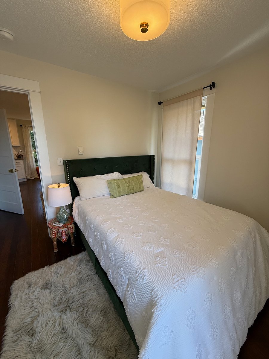 Bedroom with full bed and AC and closet