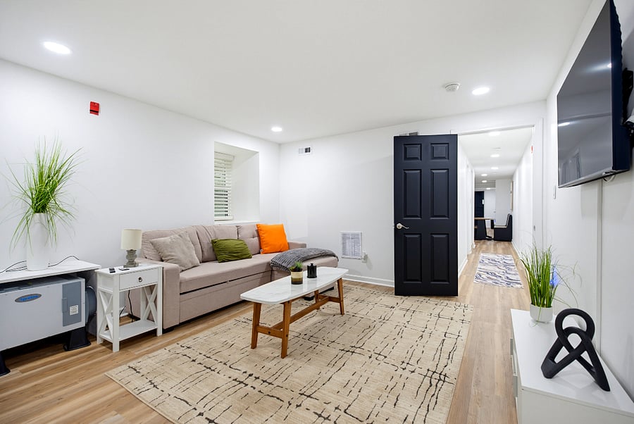 Living room view through the apartment's welcoming corridor.
