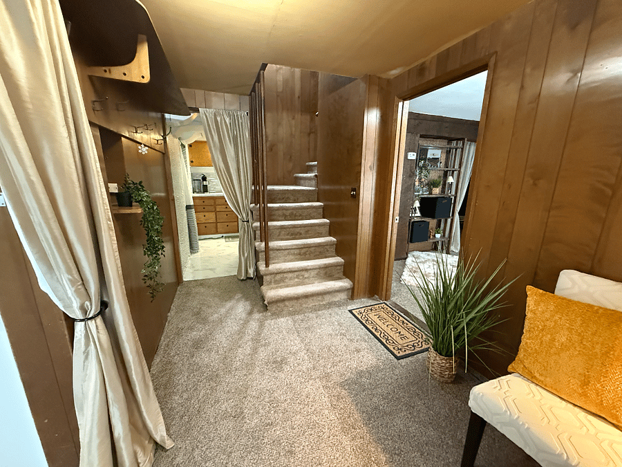 Hallway and stairs are shared with the homeowners for access to the laundry room. The tenants living and sleeping area is behind a private, lockable door.