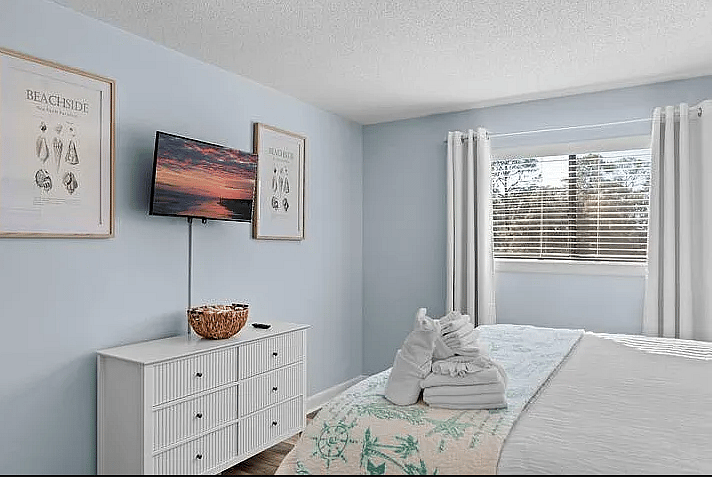 Primary bedroom has a king bed, smart TV.