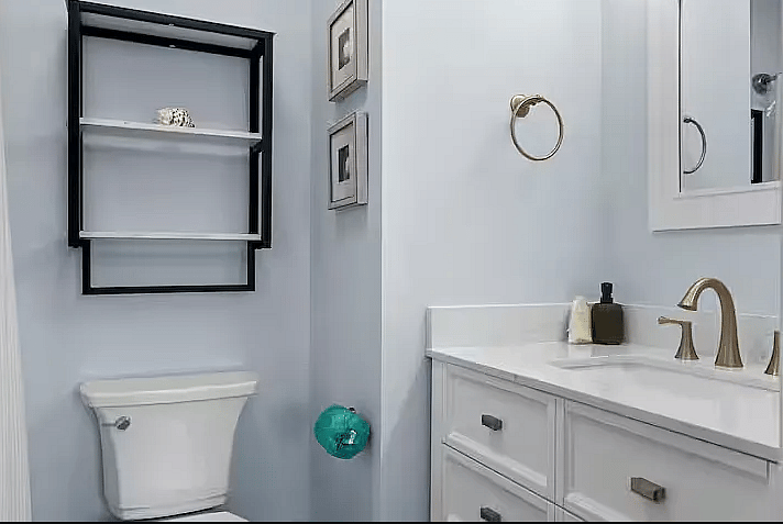 The 2nd bathroom has a tub/shower combo, toilet, and single sink with vanity.