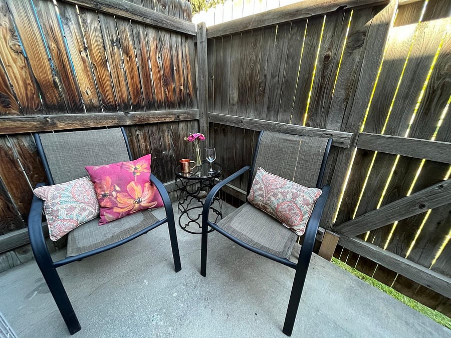 Patio area.  Please note furniture is being updated and fence has been replaced.