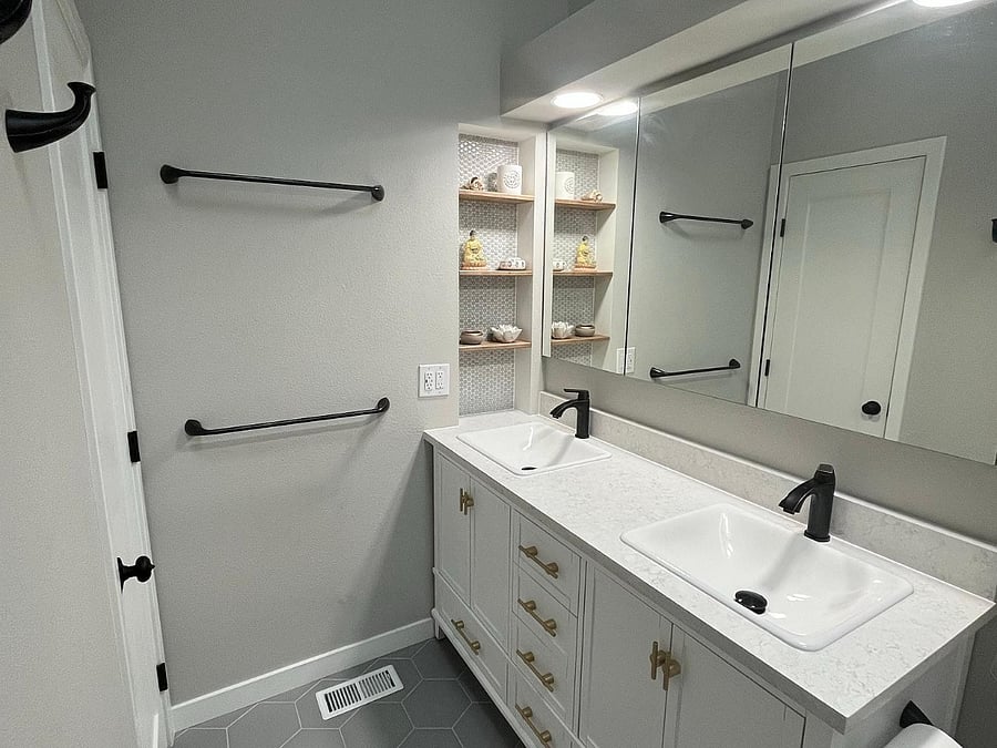 Primary bathroom with dual vanity sinks.