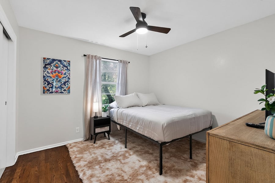 Bedroom 1- Comfortable queen size bed with hotel sheets and 4 pillows. 
