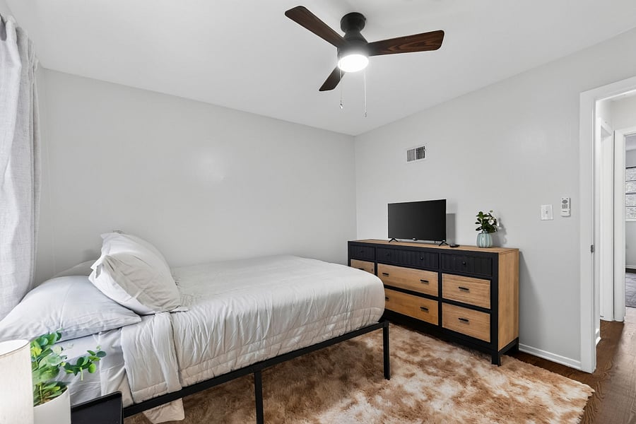 Bedroom 1- Comfortable queen size bed with hotel sheets and 4 pillows.
