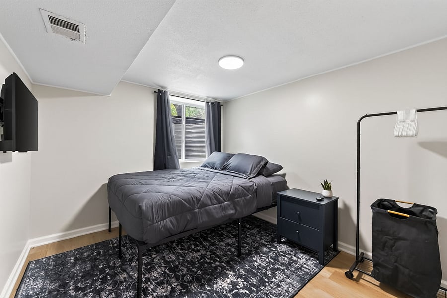 Bedroom 3- Comfortable queen size bed with hotel sheets and 4 pillows. 
