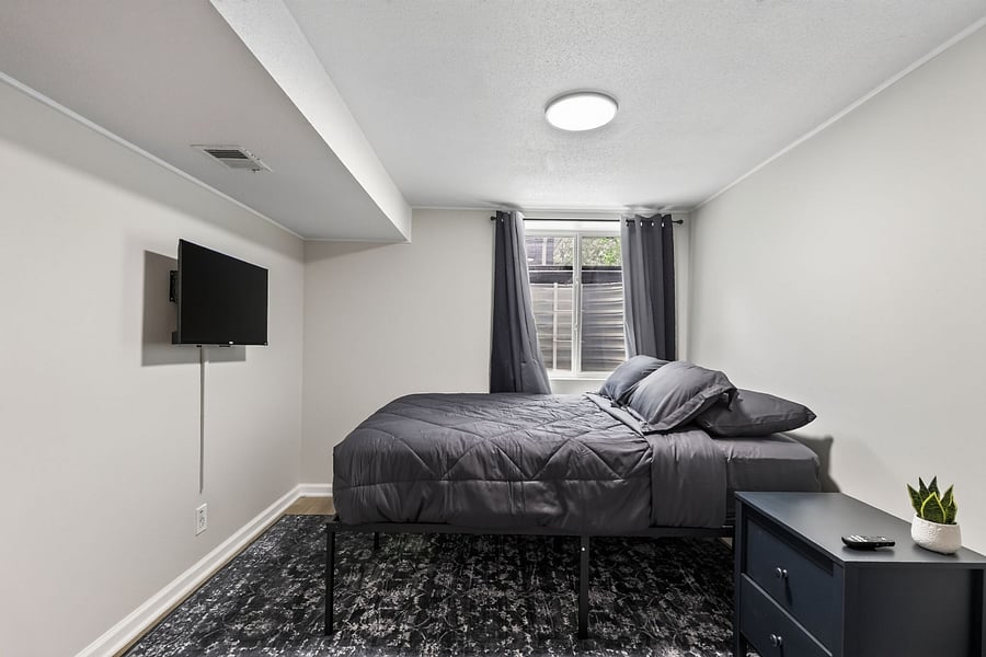 Bedroom 3- Comfortable queen size bed with hotel sheets and 4 pillows. Black out curtains. This bedroom also has a half bathroom. 