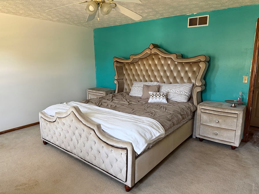     Bright Additional Bedroom  Spacious furnished bedroom featuring natural light, a ceiling fan, storage, and a dedicated desk area.