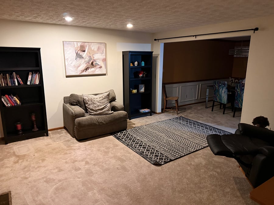     Additional Living & Reading Space  Flexible furnished living area with bookshelves and plenty of room to relax, read, work, or gather.