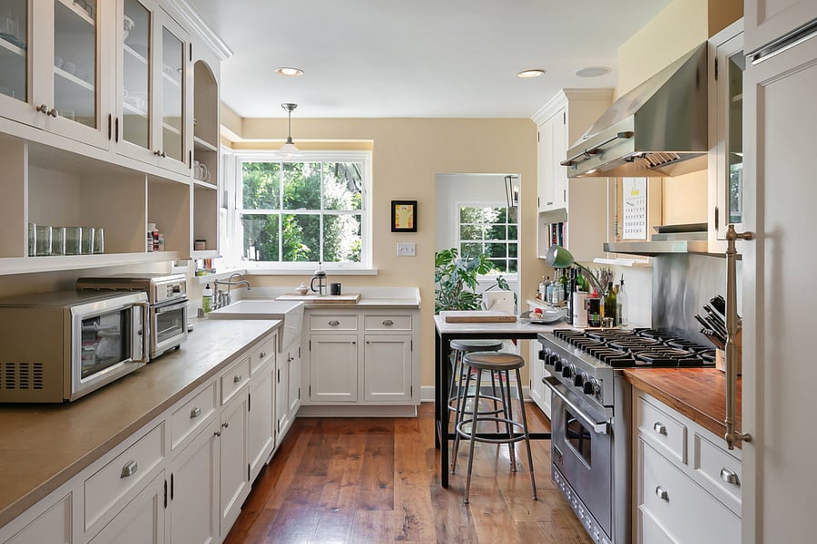 The gourmet kitchen that features a Viking range, farmhouse sink, a dinette area for guests and morning coffee.
