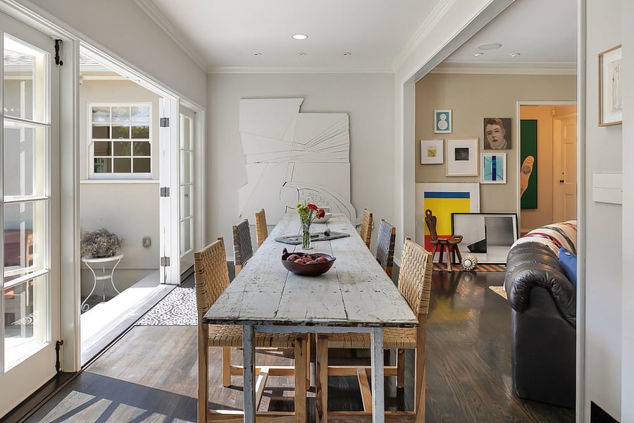 View from the sitting area of the dining that includes the perfect dining table ideal for entertaining and artworks for your viewing enjoyment.