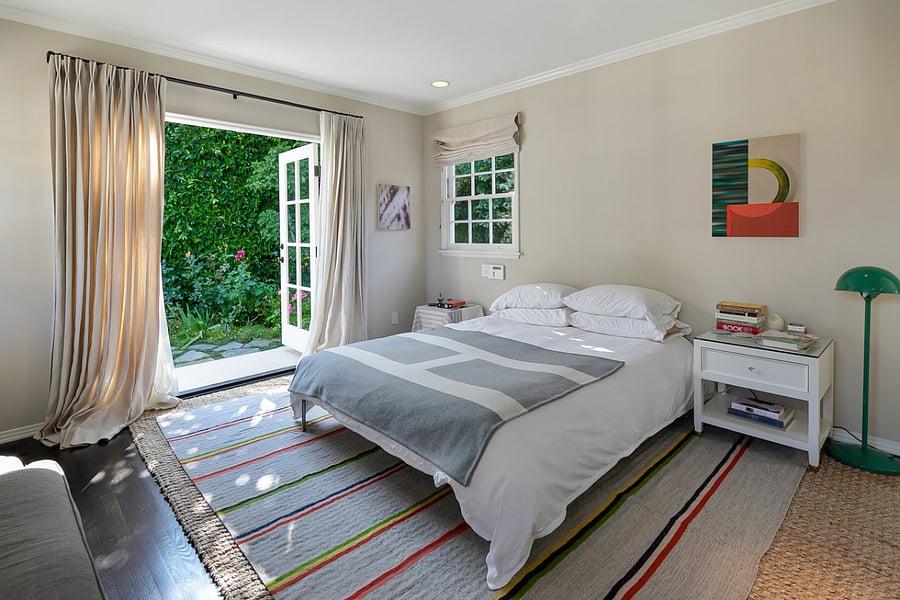 Master suite featuring French doors that allow private access to the backyard.