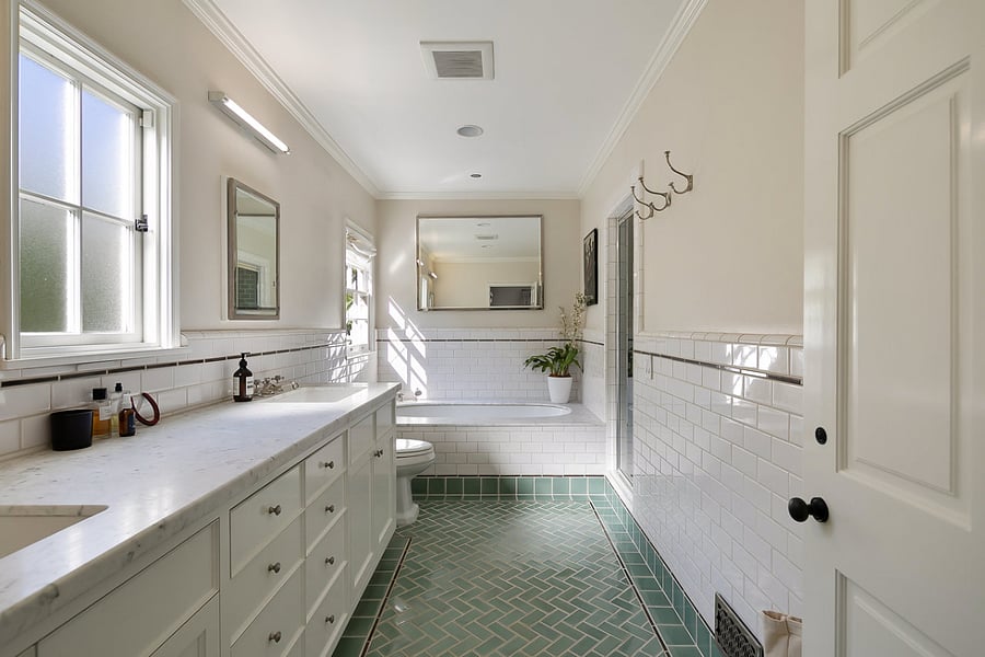Master bathroom featuring luxurious soaker tub and separate shower on the right side.