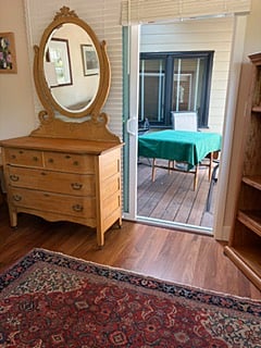 Sliding glass doors leading to private, covered deck.