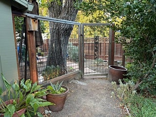 Gate entrance to rental.Mid-sized refrigerator.