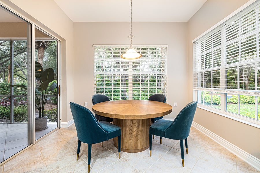 Breakfast area overlooking tropical landscaping