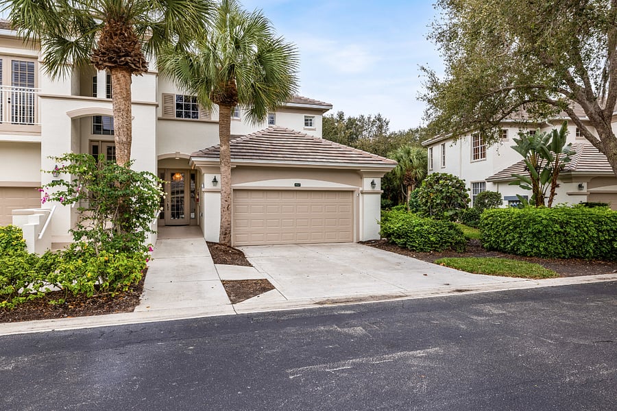 End-unit coach home with private two-car attached garage