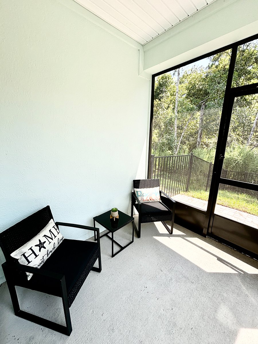 Screened in patio with seating, on a preserve, wooded lot guarantees peaceful mornings/evenings