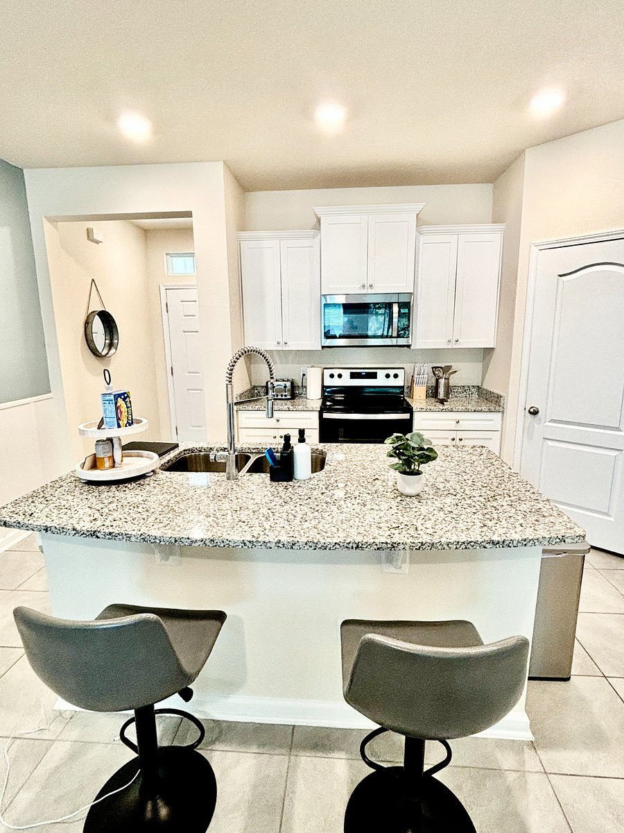 Kitchen area with bar seating at the counter