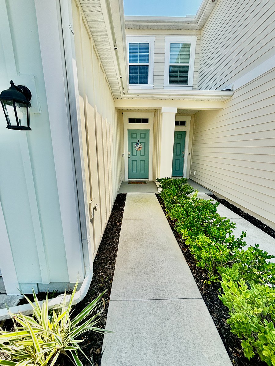 Exterior walkway leading into the home