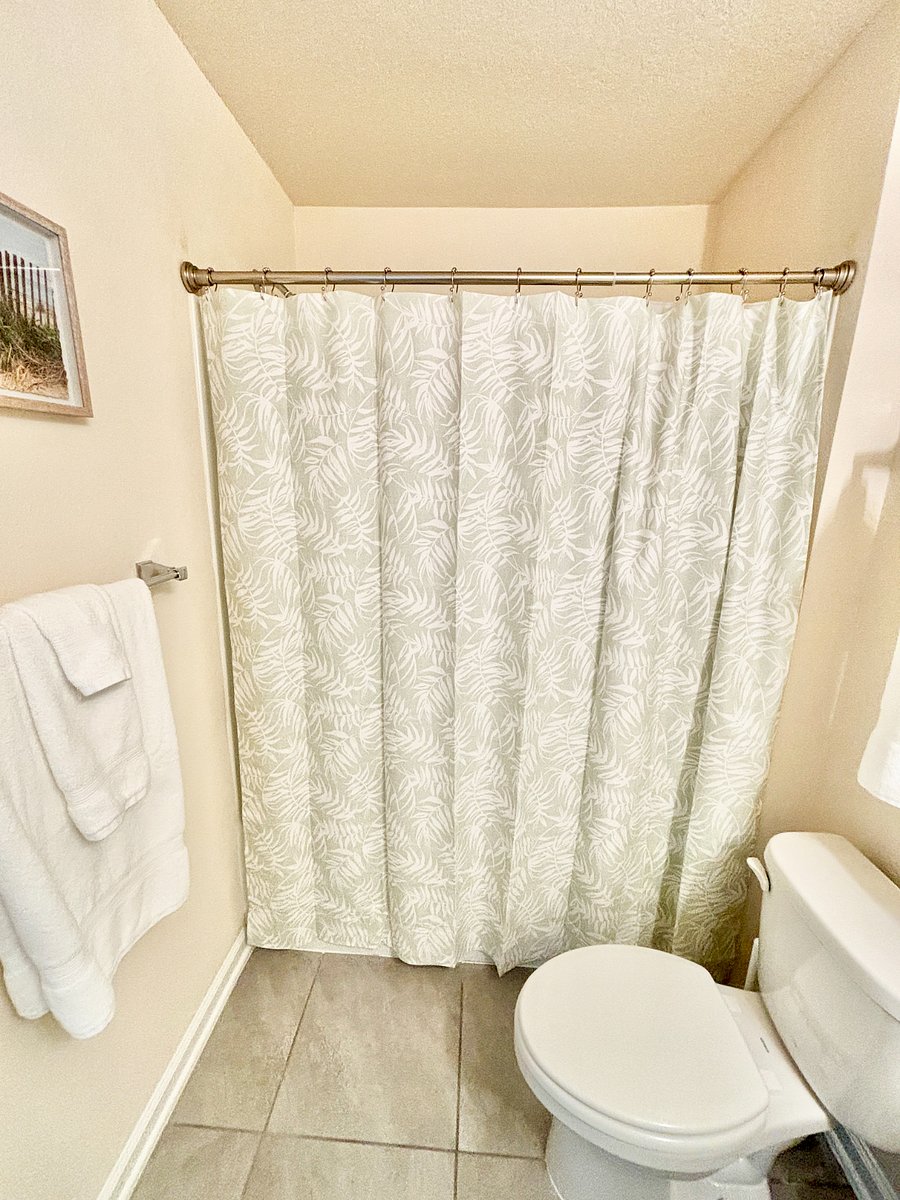 Second upstairs bathroom (tub/shower combo), en-suite to second bedroom (queen bed)