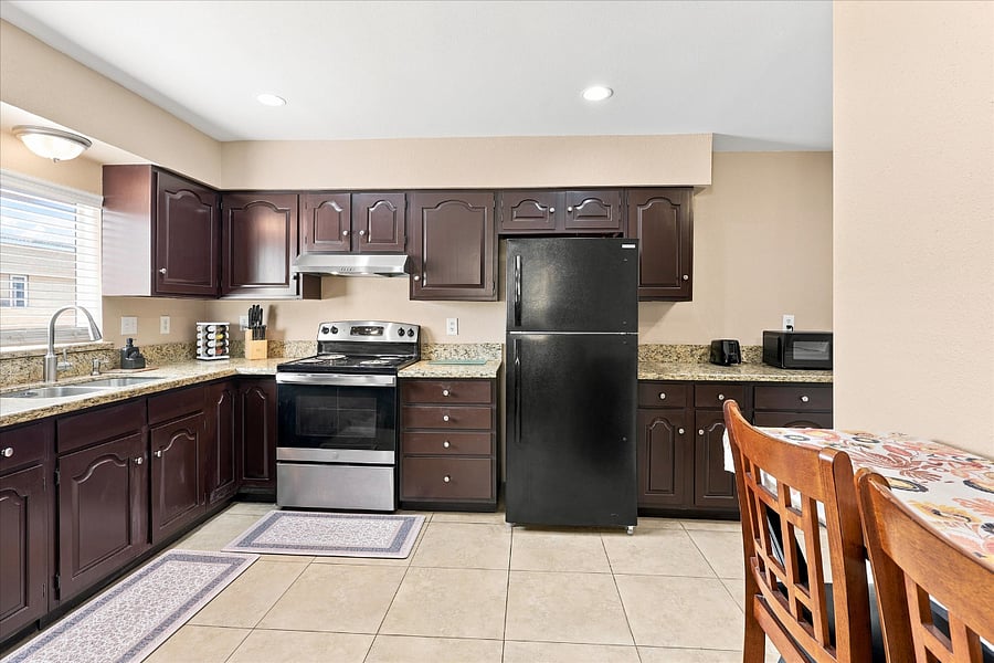 Fully stocked kitchen with breakfast bar