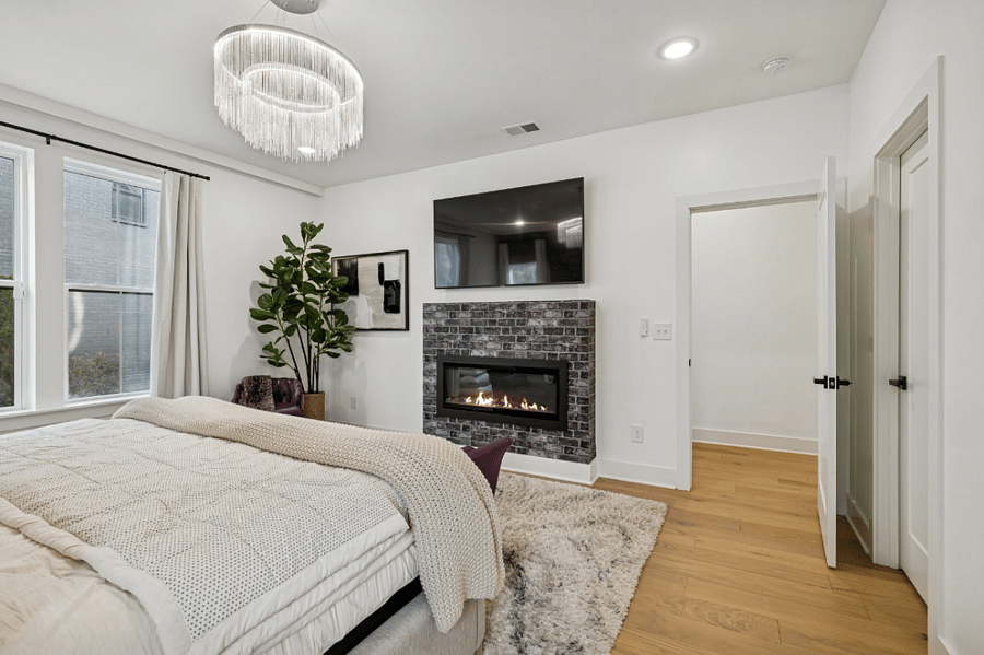 King bed with electric fireplace.
