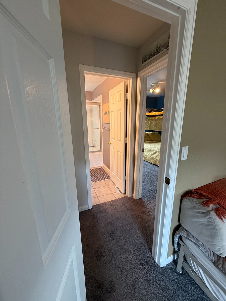 view from master b/r into upstairs bathroom across hallway