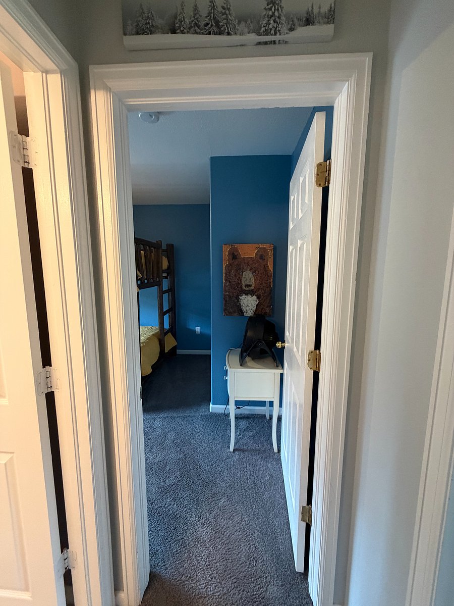 view of hallway from top of stairs into 2nd b/r