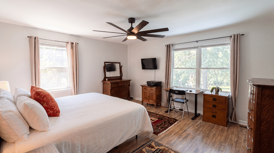 Master bedroom with king bed, walk-in closet, 2x dressers, adjustable desk and printer.