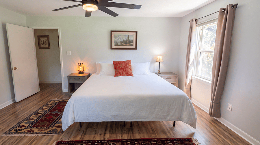 Master bedroom with king bed, walk-in closet, 2x dressers, adjustable desk and printer.