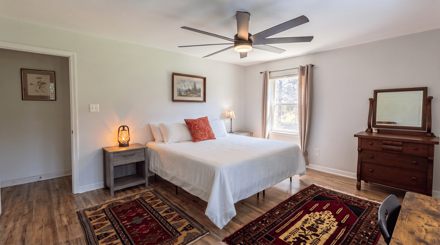 Master bedroom with king bed, walk-in closet, 2x dressers, adjustable desk and printer.