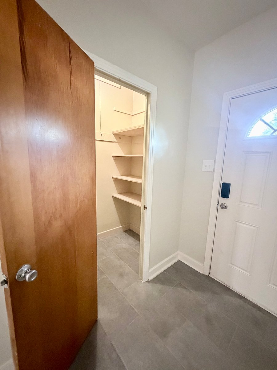 Everything in Its Place An organized entryway closet with additional linens and household essentials keeps the space comfortable and uncluttered.