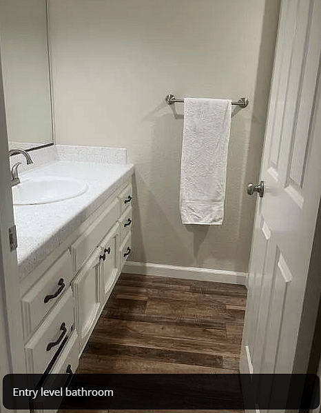Main floor bathroom with full private shower and toilet.