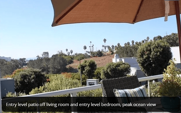 Small ocean view and greenbelt view from the balcony off the living room and main floor bedroom.
