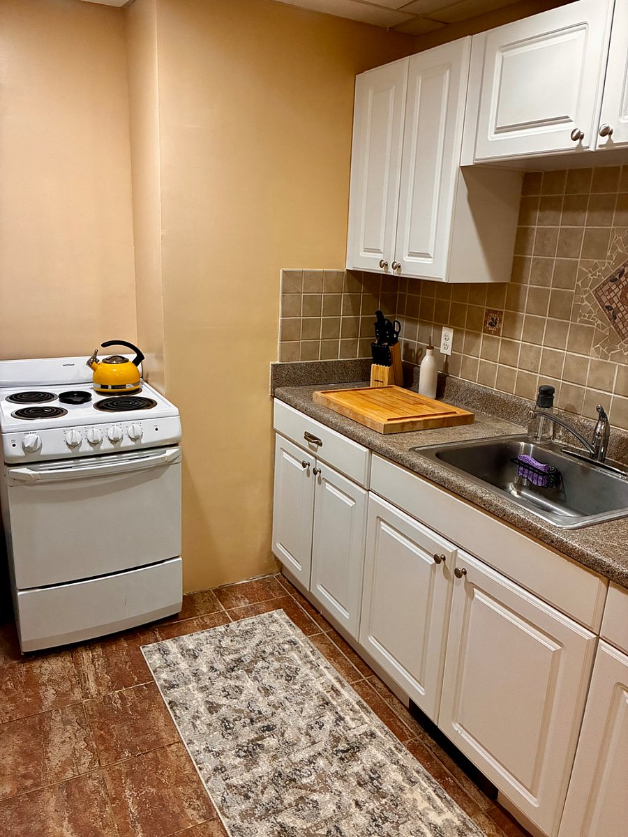 Kitchen with all appliances microwave / toast oven coffee making stove top full size refrigerator etc.