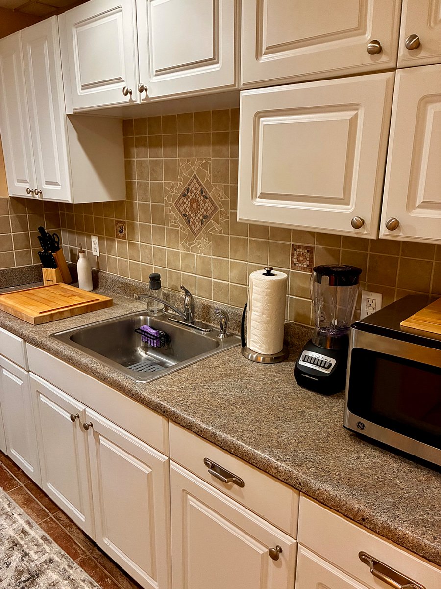 Kitchen includes cutting boards, paper towel holders and spare rolls, dish and dryer rack, stone, dish soap and refills, salt and pepper, cinnamon, tea bags, oil and vinegar, food storage containers
