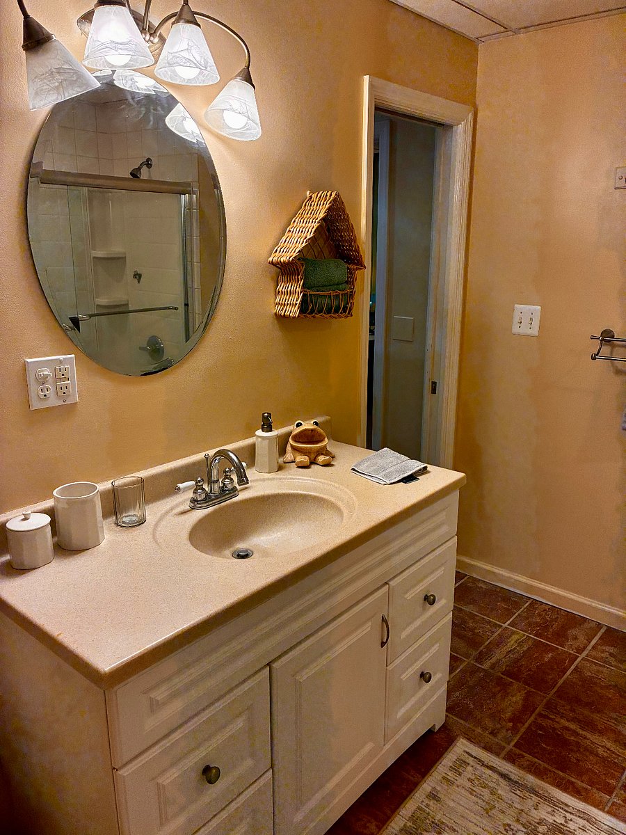 Bathroom Large size vanity sink, and mirrored medicine cabinet.