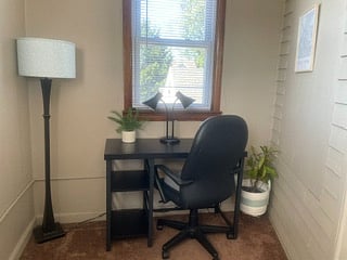 BONUS ROOM
Enjoy a dedicated workspace featuring a sleek black desk with storage shelves, an ergonomic task chair, and an outlet with USB ports.