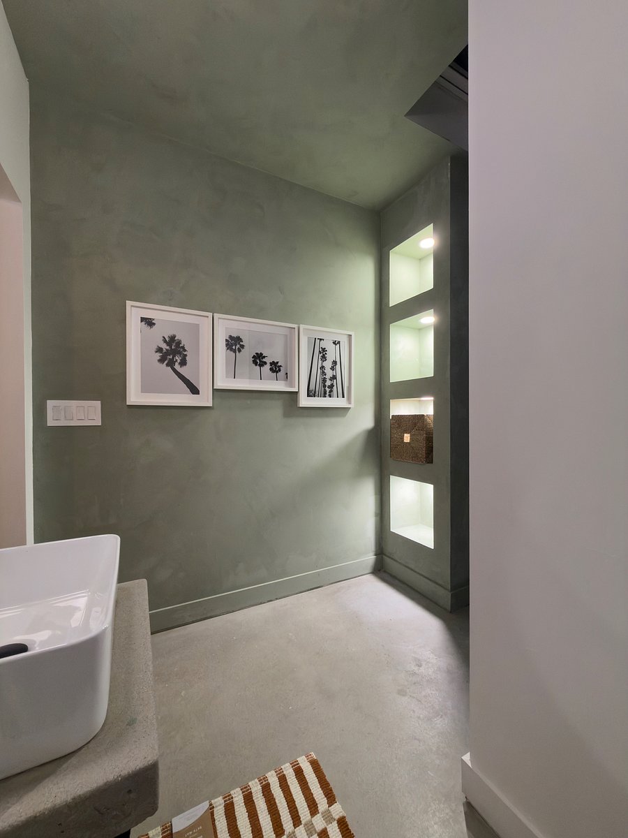 Limewash is a mineral finish made from limestone. It's naturally alkaline, which makes it resistant to mold, mildew, and bacteria, and it lets walls "breathe," helping moisture escape instead of getting trapped.