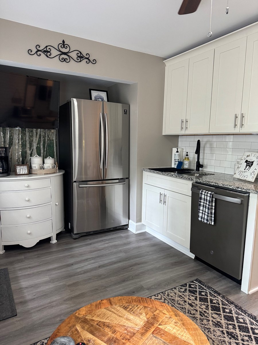 Full-size fridge and coffee bar - NOTE -1 smart TV for living space is located on wall behind coffee bar ( left side). Second smart TV is in bedroom above desk and workspace.