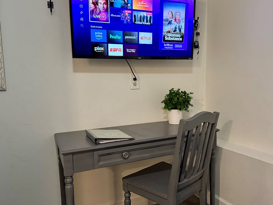 Designated workspace in master bedroom & smart TV.