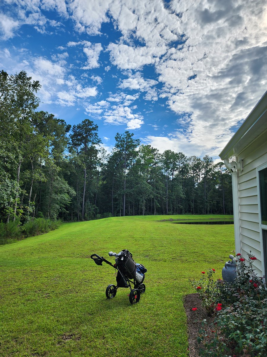Back yard view Bring your golf clubs, practice net, and biodegradable golf ball,, fishing pole, Bike, yoga mat , camera and walking shoes. There s life after work enjoy it 