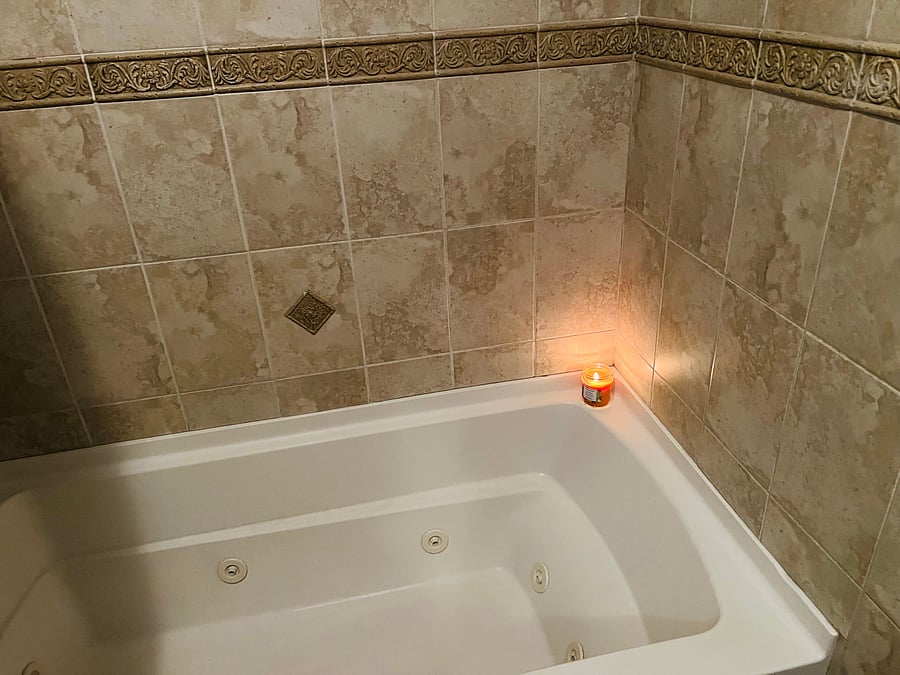 Master bath soaker jacuzzi tub and shower for one.