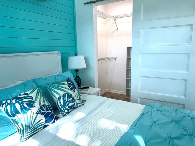 Walk in closet with lots of storage, shelves and hangers