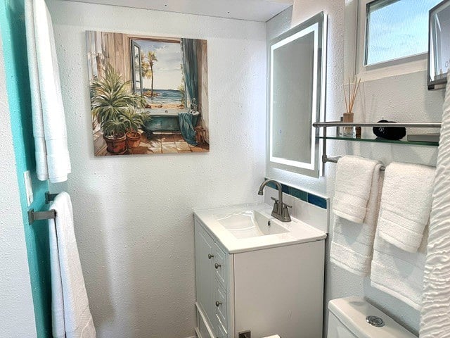 Bathroom with blow dryer, make-up mirror, make-up remover washcloths, extra outdoor towels. Cabinet has plenty of room and toilet tissue for a week.
